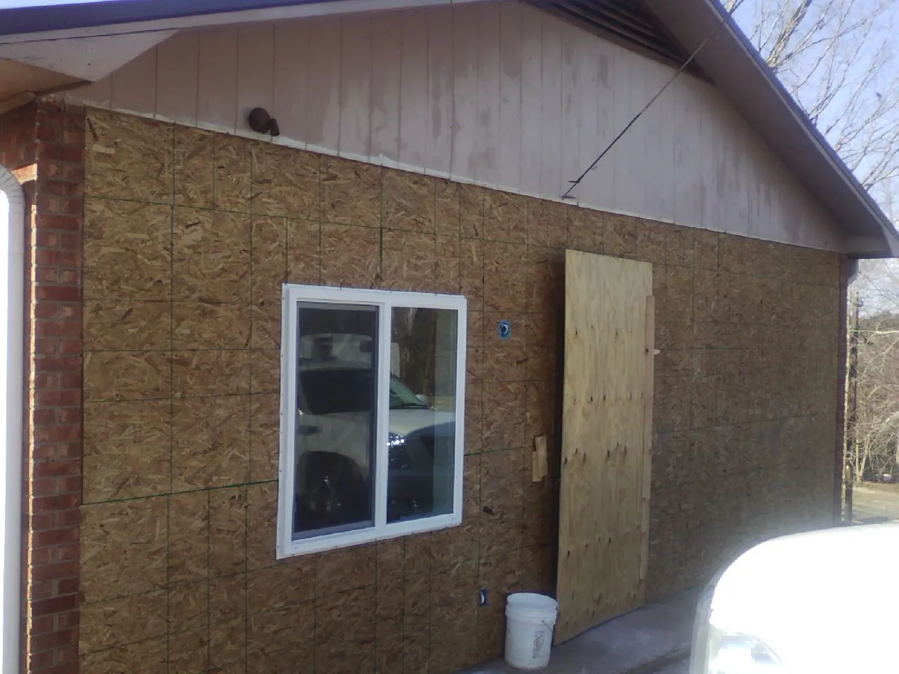OSB sheathing on a garage addition wall before siding in Steubenville